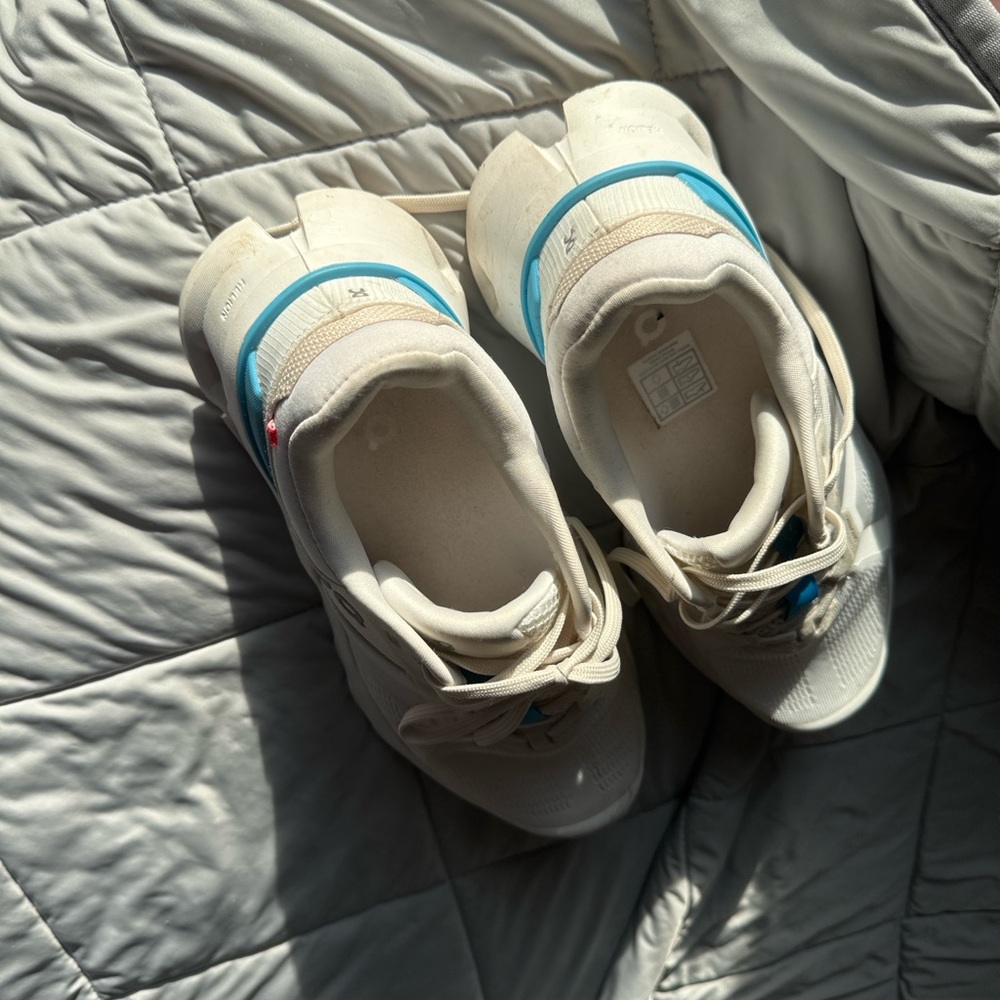 On Running Cream and White Sneakers